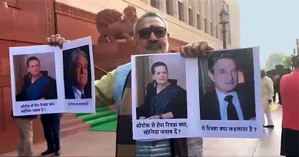 संसद भवन परिसर में सोनिया-सोरोस की तस्वीर लेकर पहुंचे गिरिराज, जानिए मामला।