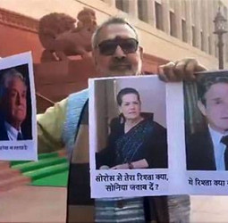 संसद भवन परिसर में सोनिया-सोरोस की तस्वीर लेकर पहुंचे गिरिराज, जानिए मामला।